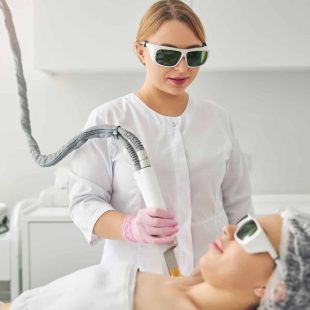 Calm young woman undergoing a cosmetic procedure